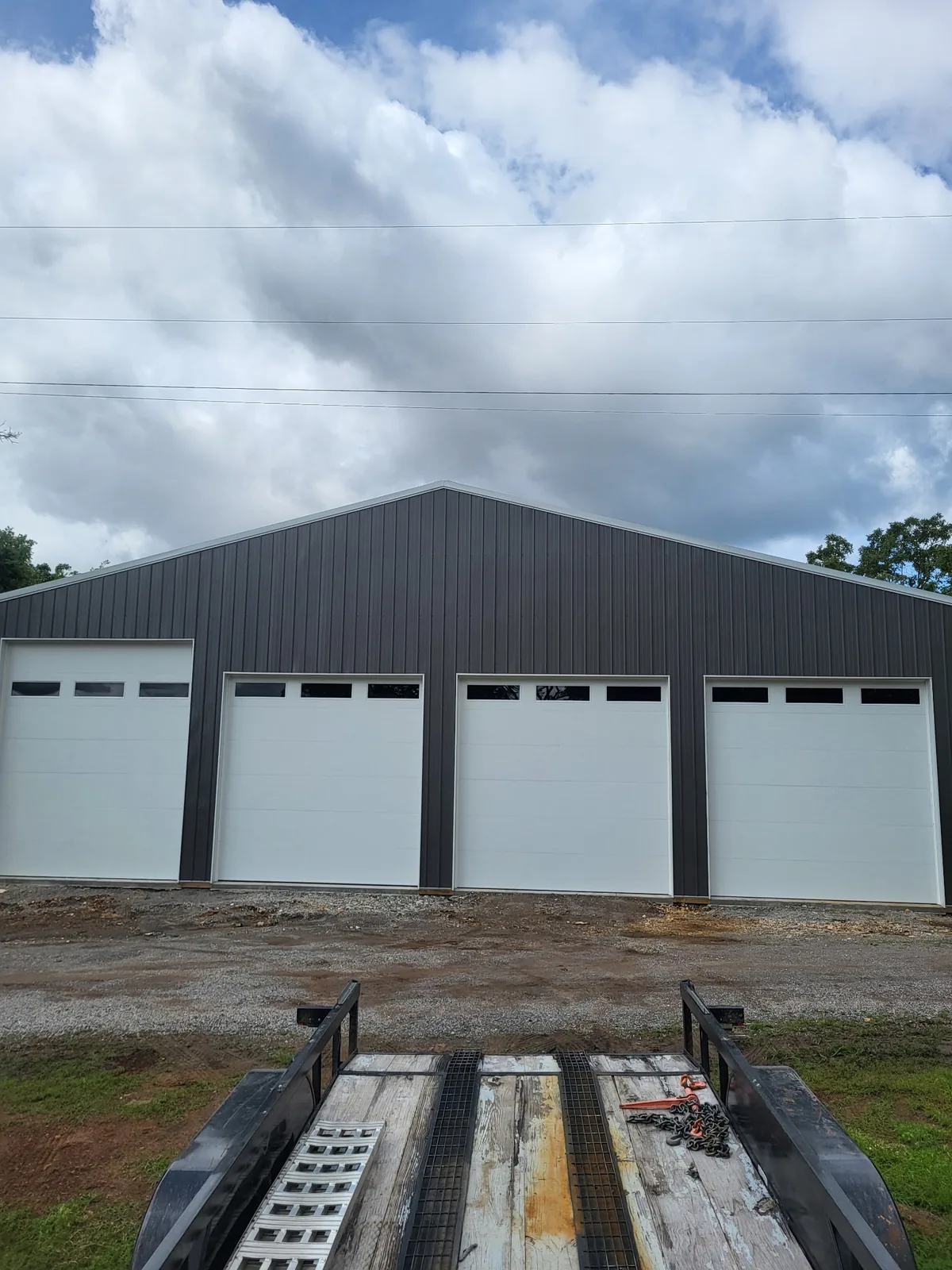 Commercial shop building with multiple overhead garage doors