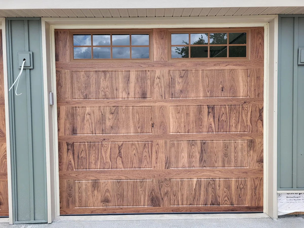 Carriage-style wood garage door installation